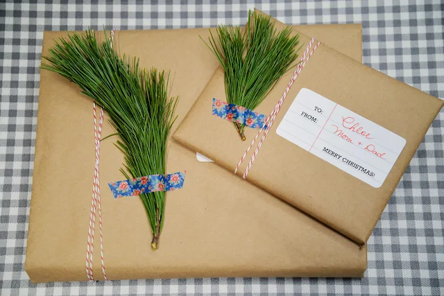 kraft paper package with baker's twine and greenery sprig washi tape | Ramblingrenovators.ca