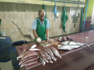 A "Fish Butcher" at work in Male' Fish Market.