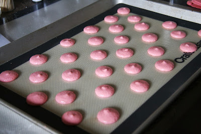 Piped macaron shells with an additional top. 