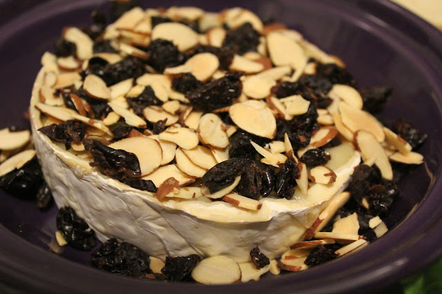 Baked Brie with toasted almonds and dried cherries