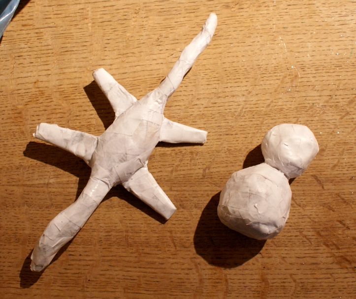 lightly enchanted Paper and glue snowman sculpture