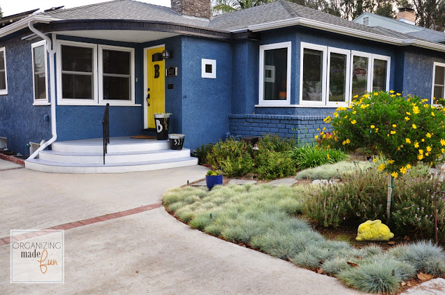 Beautiful and bold blue home with yellow front door :: OrganizingMadeFun.com