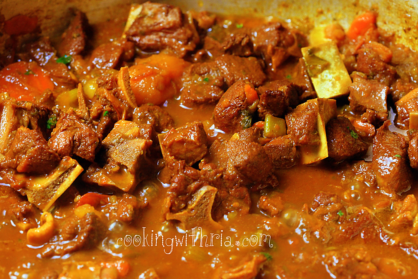 Serve hot over rice, flour/corn dumplings or boiled ground provisions.