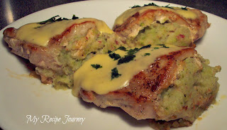Creamy Vegetable Stuffed Pork Chops Topped with a Light Cheese Sauce