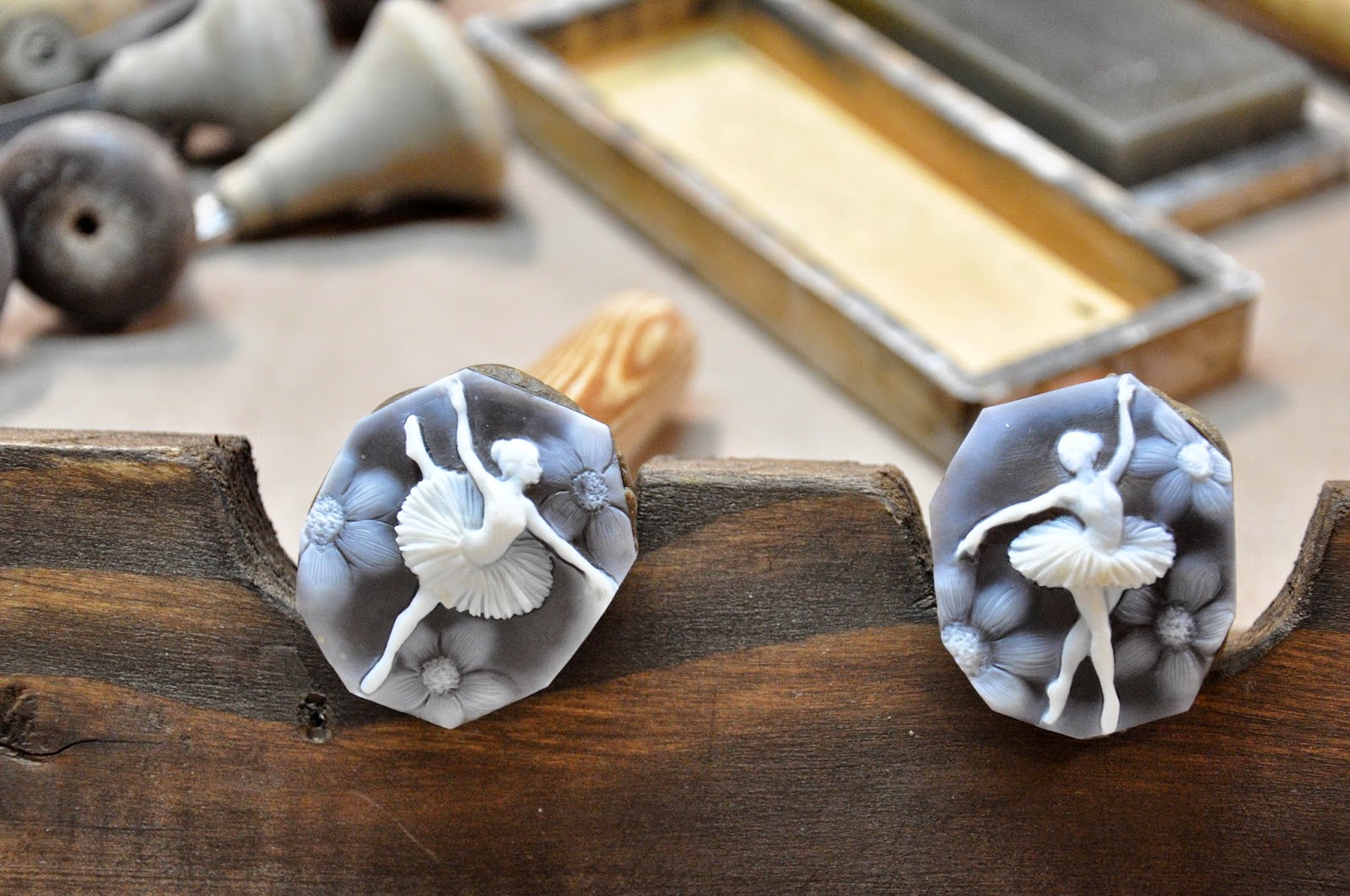 Two finished cameos with chisels Two finished cameos with chisels