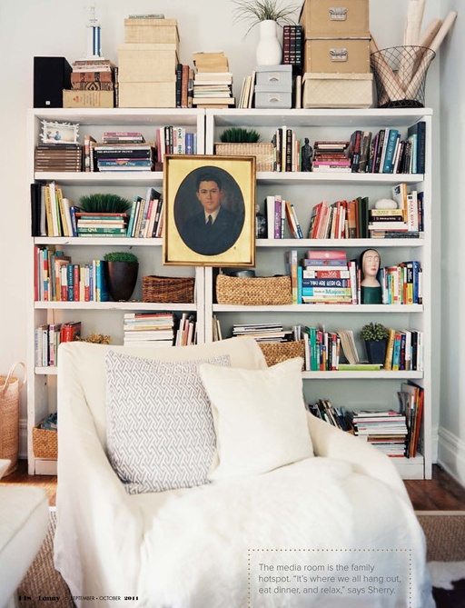 a perfect gray hanging art on the bookcase