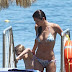 Helena Christensen shows off her bikini body and abs 