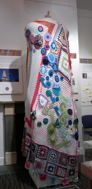 Displayed on a very large dress form, a ceremonial robe made of granny blaknets and appliqued crocheted shapes which was yarn bombed on the statue of Queen Victoria in Victoria Square, Adelaide, December 2012.