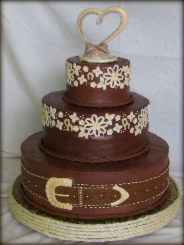 This fun western style wedding cake was created in August for a girl who 
