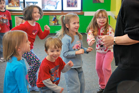 photo of: Preschool Children Engaged in "The Carrot Seed" Dance Story Activity at PreK+K Sharing