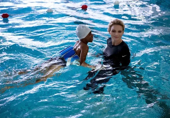 Princess Charlene of Monaco attended a activity supported from her founding at the St. Charles College's pool