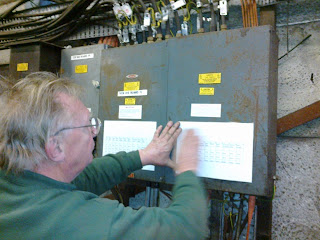 John documenting circuits on the distribution boards