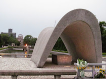 Memorial Cenotaph, with Peace Flame between it and Atomic Dome across the river, Hiroshima, Japan