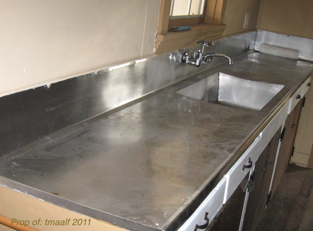 ... . On the left, is a new stainless steel all in one sink and counter