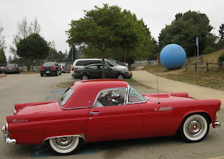 Vintage 1955 red Thunderbird convertible with hard top