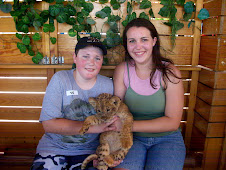 Logan and Jordan holding a baby Lion July 2011 Cabo San Lucas
