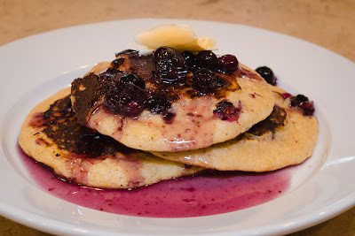 whole wheat blueberry pancakes and blueberry maple syrup