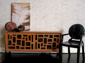 Modern miniature scene with mid-century sideboard, black ghost chair and chinese print of geese in colours of brown and black
