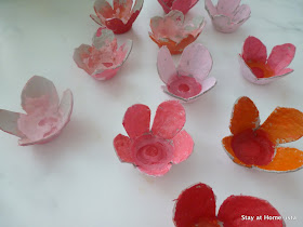Use an egg crate to create cardboard cherry blossoms, then paint the with your kids. And easy spring DIY craft.
