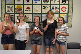 Teenage cupcake class at the Logan Hyperdome library.