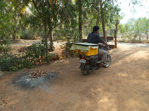 Fish seller on motorcycle in Barkur.