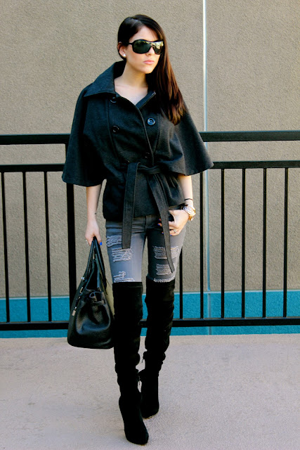 ripped jeans with over the knee boots