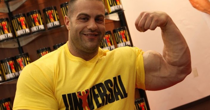 Evan Centopani Show His Huge Biceps At 2012 FIBO 2012