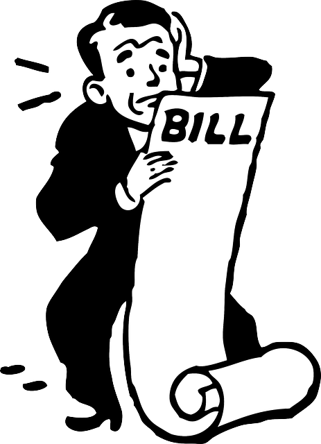 Worrying over the bills A man worries over his growing bills.