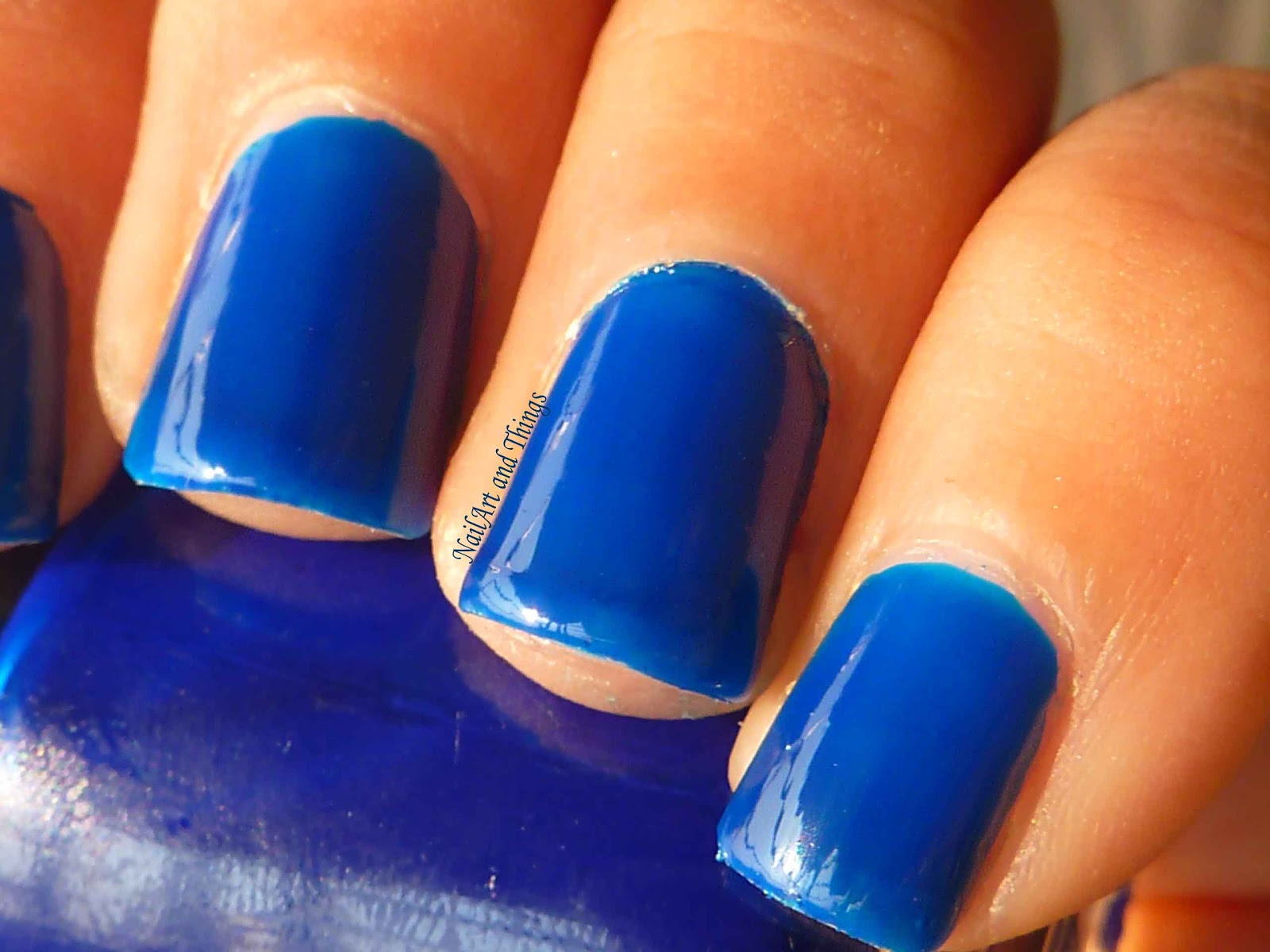 blue nail polish with white design