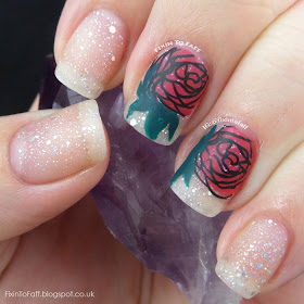 Romantic and sparkly nail art featuring roses and diamond glitter, matted.