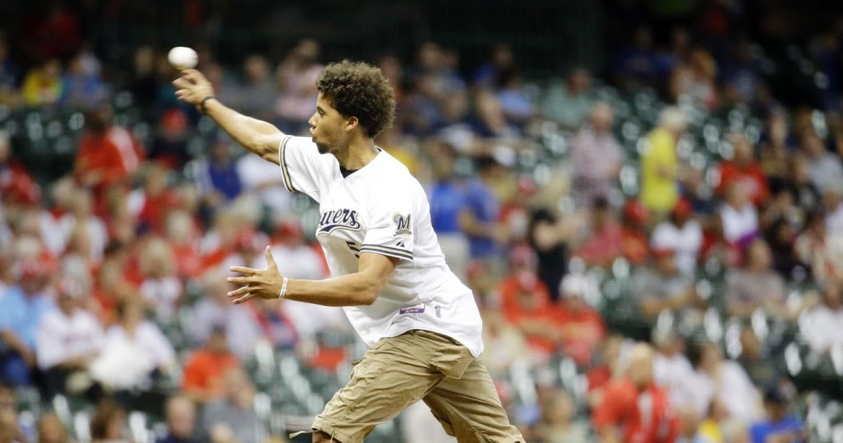 Bucks' Michael CarterWilliams throws out first pitch, hits cameraman