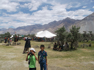 Kids and adults at the "Sand Dunes Festival"  at Hunder in Nubra valley.