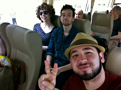 students pose together on a bus