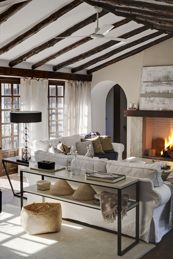 There is definitely a place for a huge fireplace in my dream home like this one. Wooden roof beams are in the plans too.