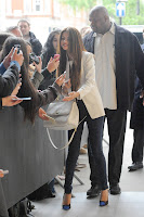 Selena Gomez taking a few photos with fans