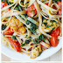 Shrimp, tomato, and spinach pasta in garlic butter sauce