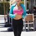 Holly Madison with sports bra while jogging
