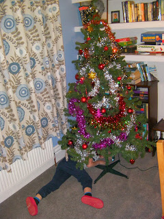 xmas tree with tinsel and baubles