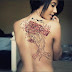 Red tree and flying bird tattoo on back 