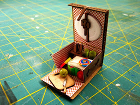 Miniature picnic basket with contents.