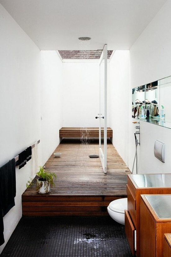 A long decked shower that brings the outdoors inside (found via Remodelista)