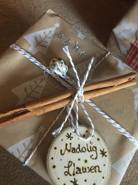 christmas wrapping with wooden disc pyrography