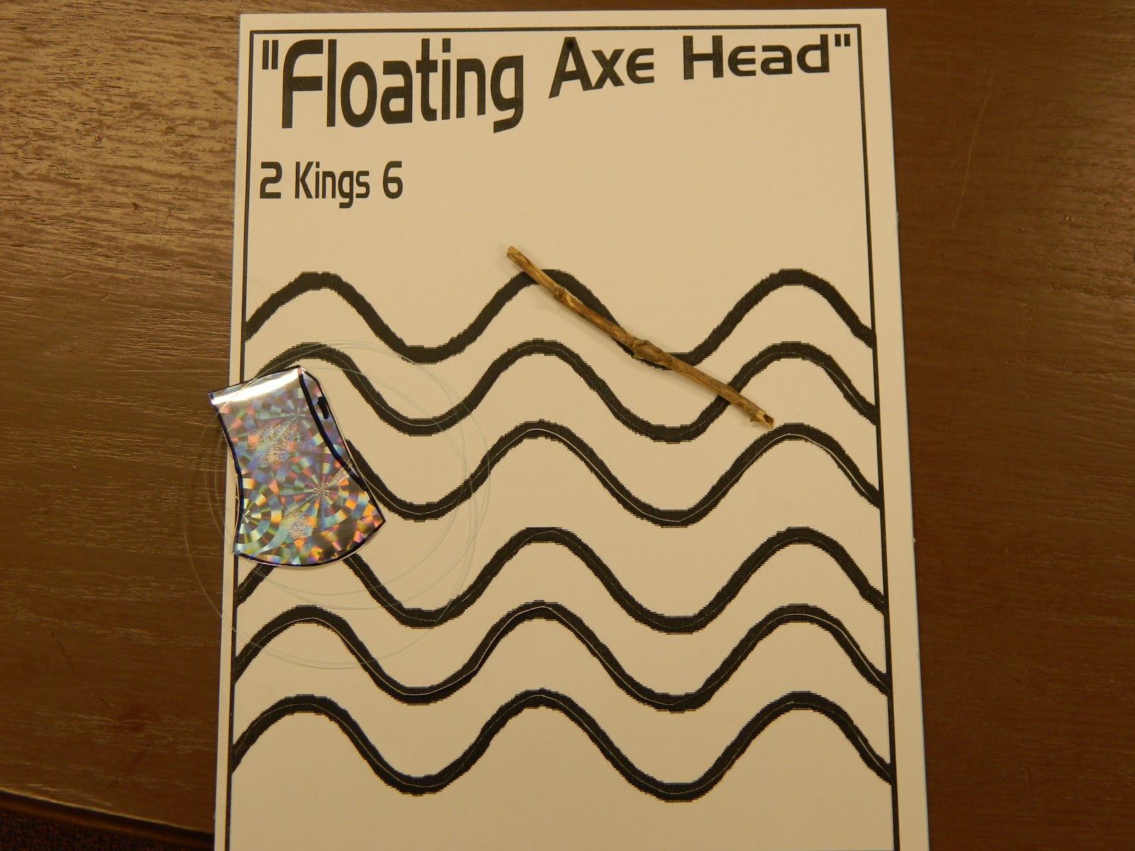 Hands On Bible Teacher A Floating Axe Head.