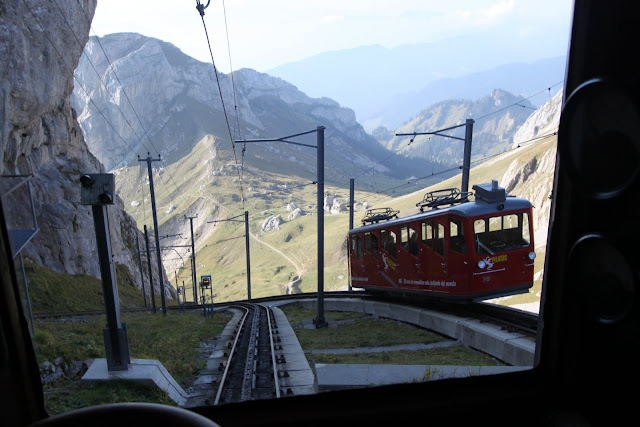 Riding in a Locher cogwheel train from Pilatus Kulm to Alpnachstad station at Mount Pilatus in Lucerne, Switzerland Riding in a Locher cogwheel train from Pilatus Kulm to Alpnachstad station at Mount Pilatus in Lucerne, Switzerland