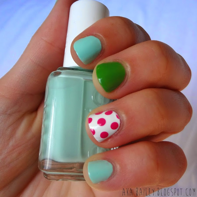 Mint nails with green and pink polka dot accents