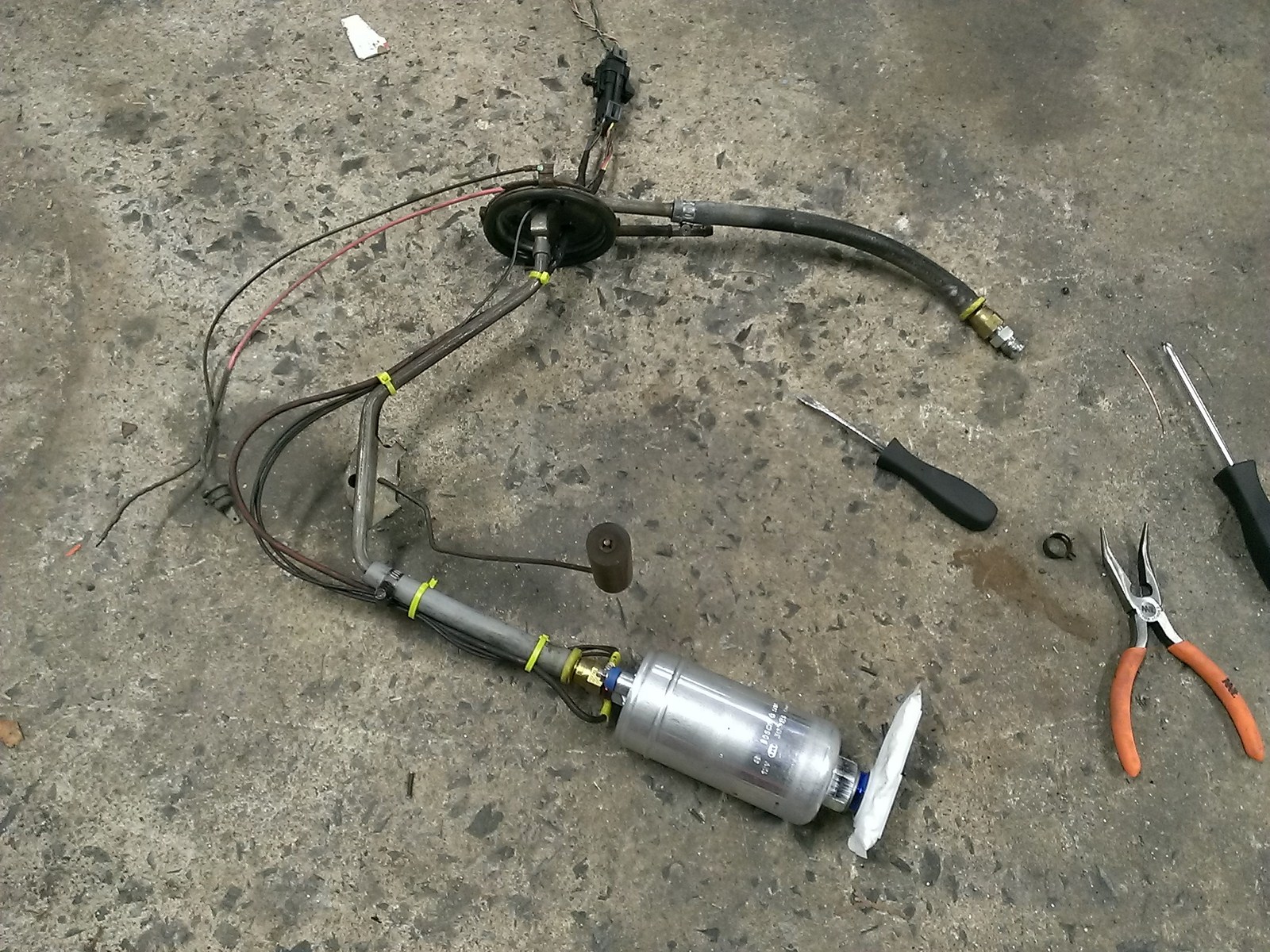 Sloppy Mechanics built a downpipe, recirculated the wastegate, and retrofitted the tank with a