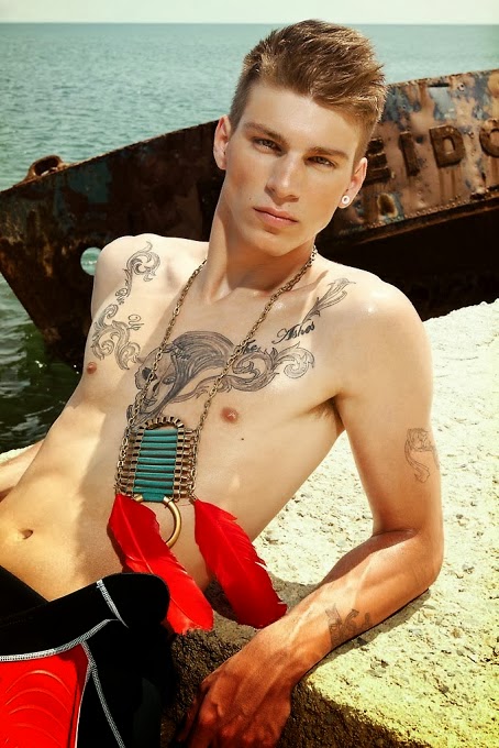 young-smooth-hairless-naked-chest-gay-blond-boy-tattoo-chains-harbor-boat-sunshine-model-beauty-cute-lips-ear-ring-piercing-shirtless.jpg
