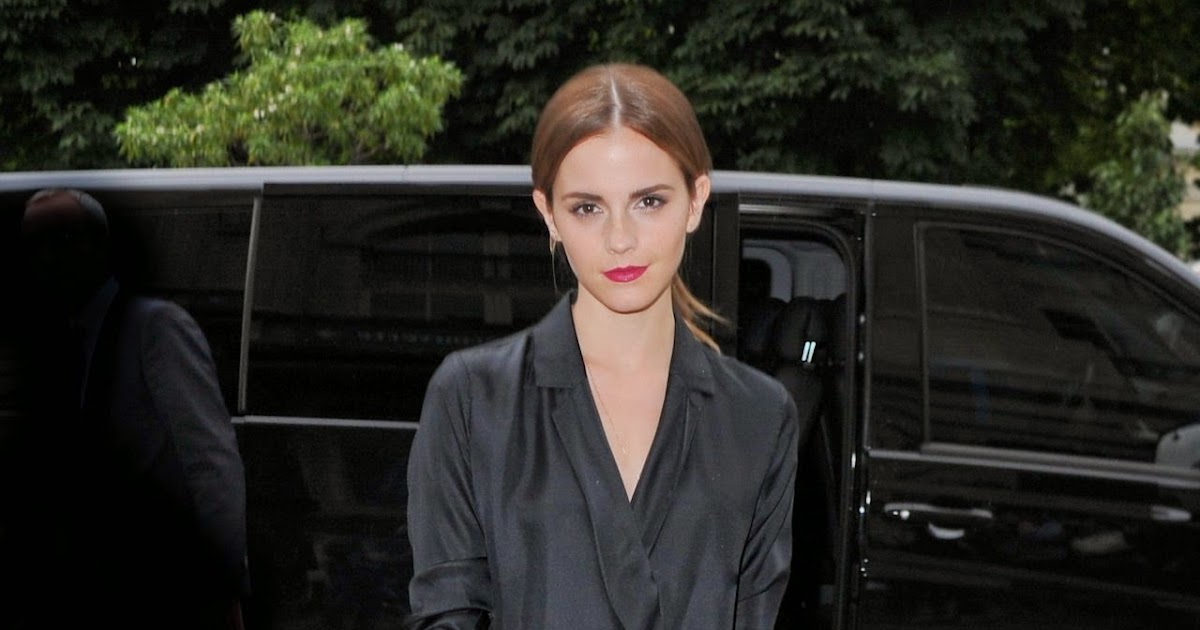 Emma Watson arrives in a black look at the Giambattista Valli Fall 2014