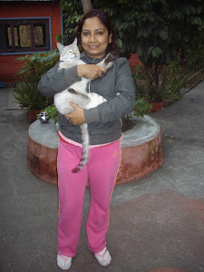 Miss Laxmi.Lamichhane with her pet cat "Suru"