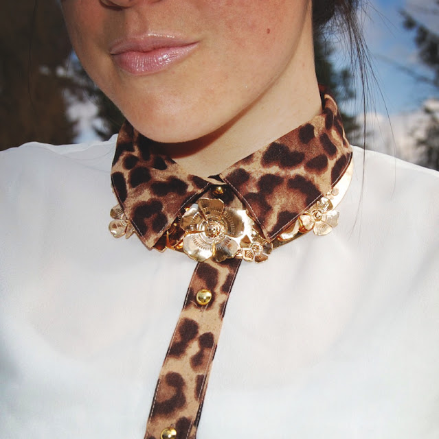 Gold collar and a leopard detailed blouse